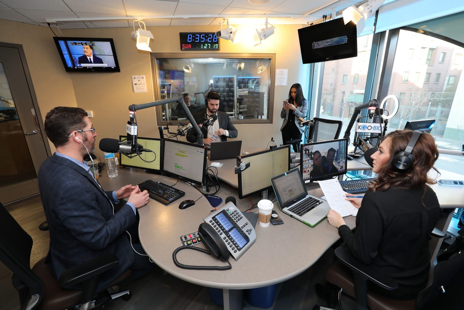 Greg and Tiffany live on air at KGO, Miles at the back mic