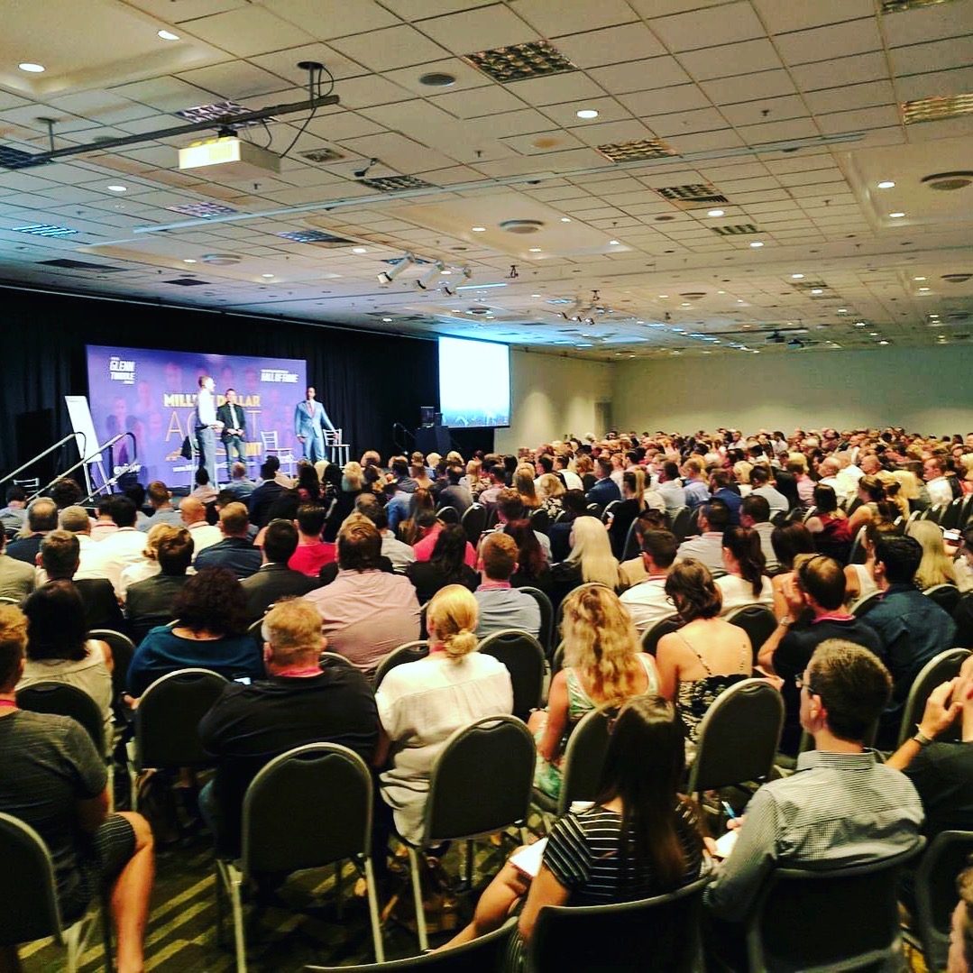 Packed crowd watching Greg on the big screens at the Million Dollar Agent Summit