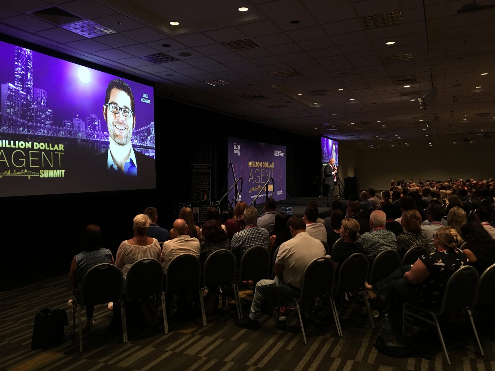 Greg on stage at the Million Dollar Agent Summit