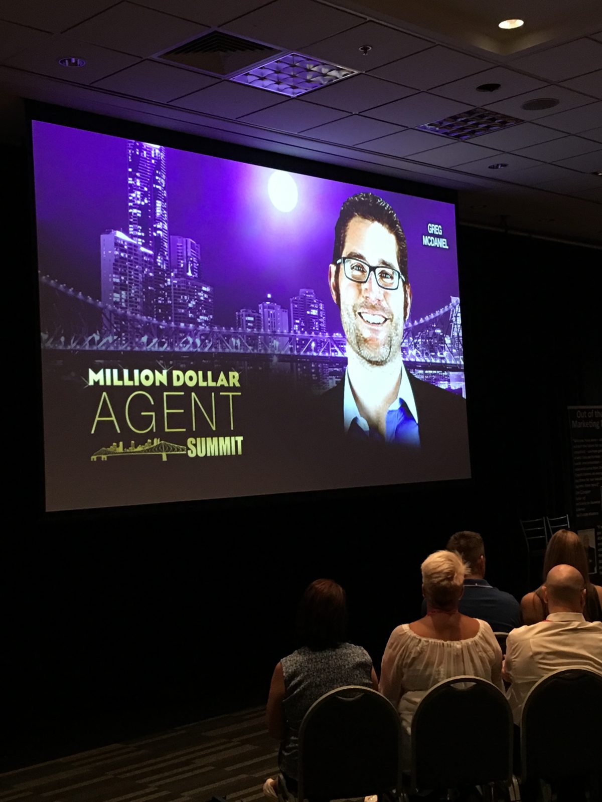 Greg on the big screen at the Million Dollar Agent Summit